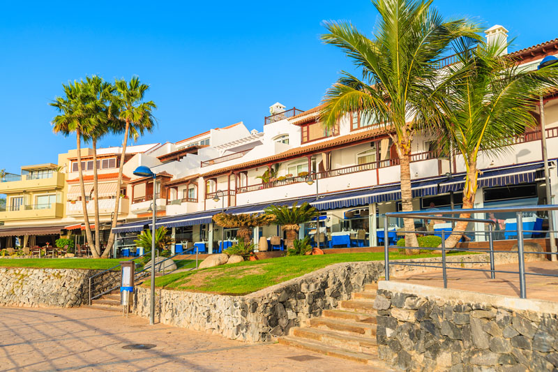 Restaurants on coastal promenade in La Caleta town on southern Tenerife, Canary Islands, Spain