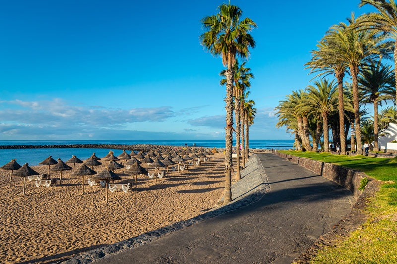 Beach in the tourist resort Playa de las Americas, Tenerife island, Canary Islands, Spain